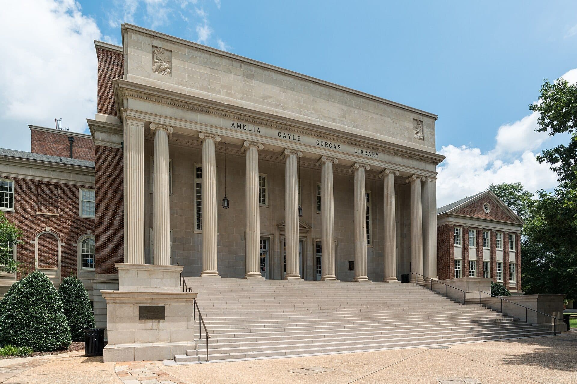 The columned limestone front and wide steps of Gorgas Library under a blue sky on UA's campus