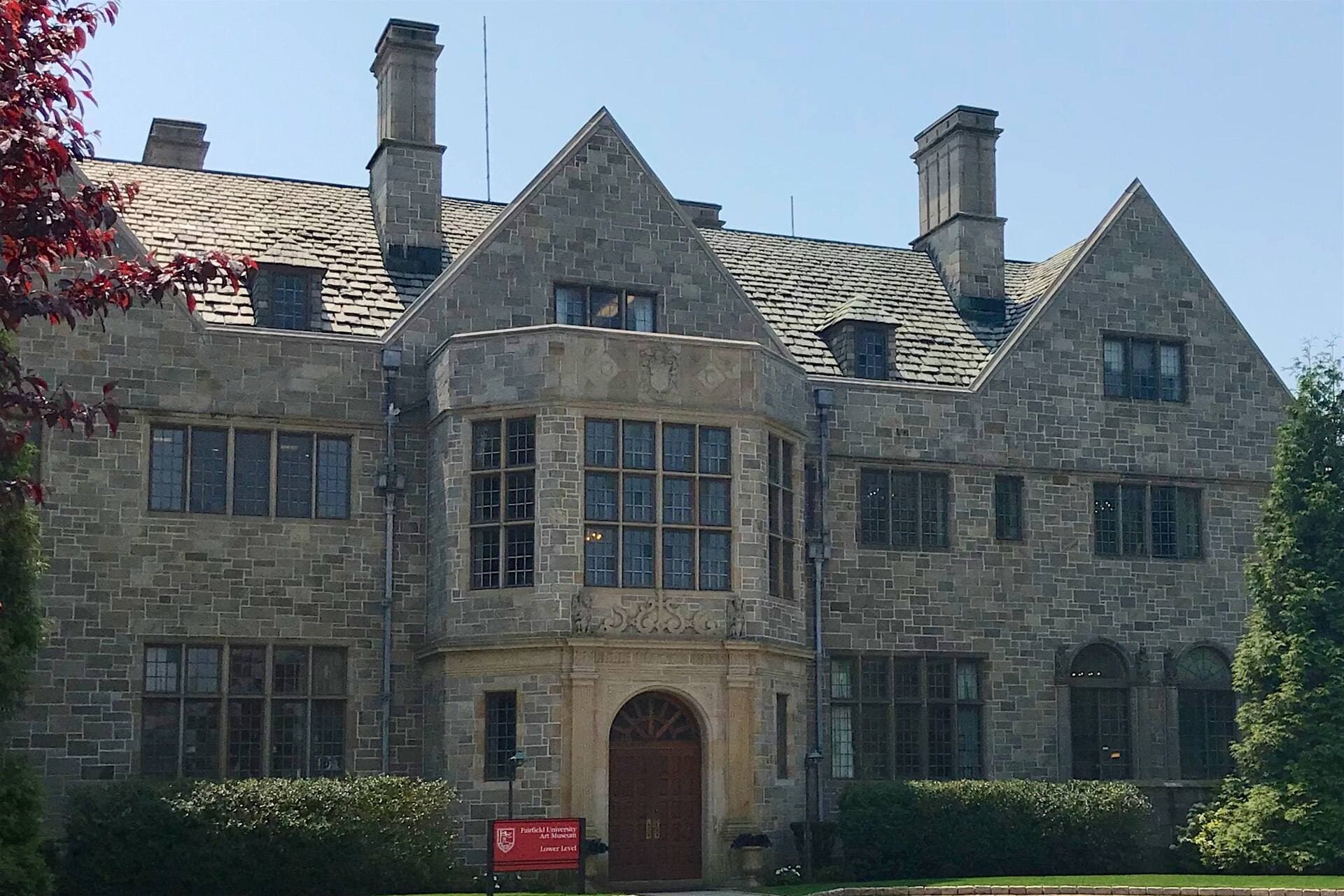 The entrance to Bellarmine Hall at Fairfield University, a stone Tudor-style building that houses the Fairfield University Art Museum