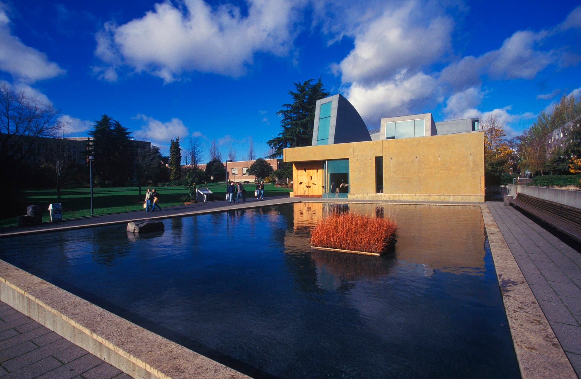 The Chapel of St. Ignatius and its reflecting pool under a bright blue sky on the Seattle University campus