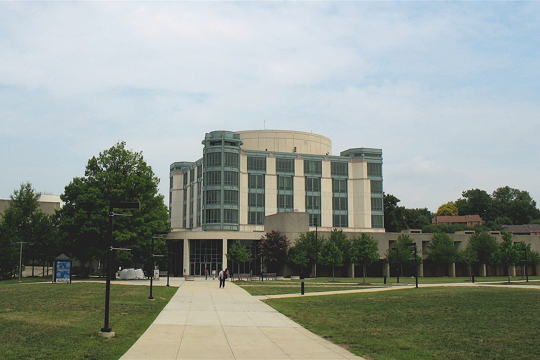 UMBC's Albin O. Kuhn Library seen from the University Commons, with a walkway across the quad
