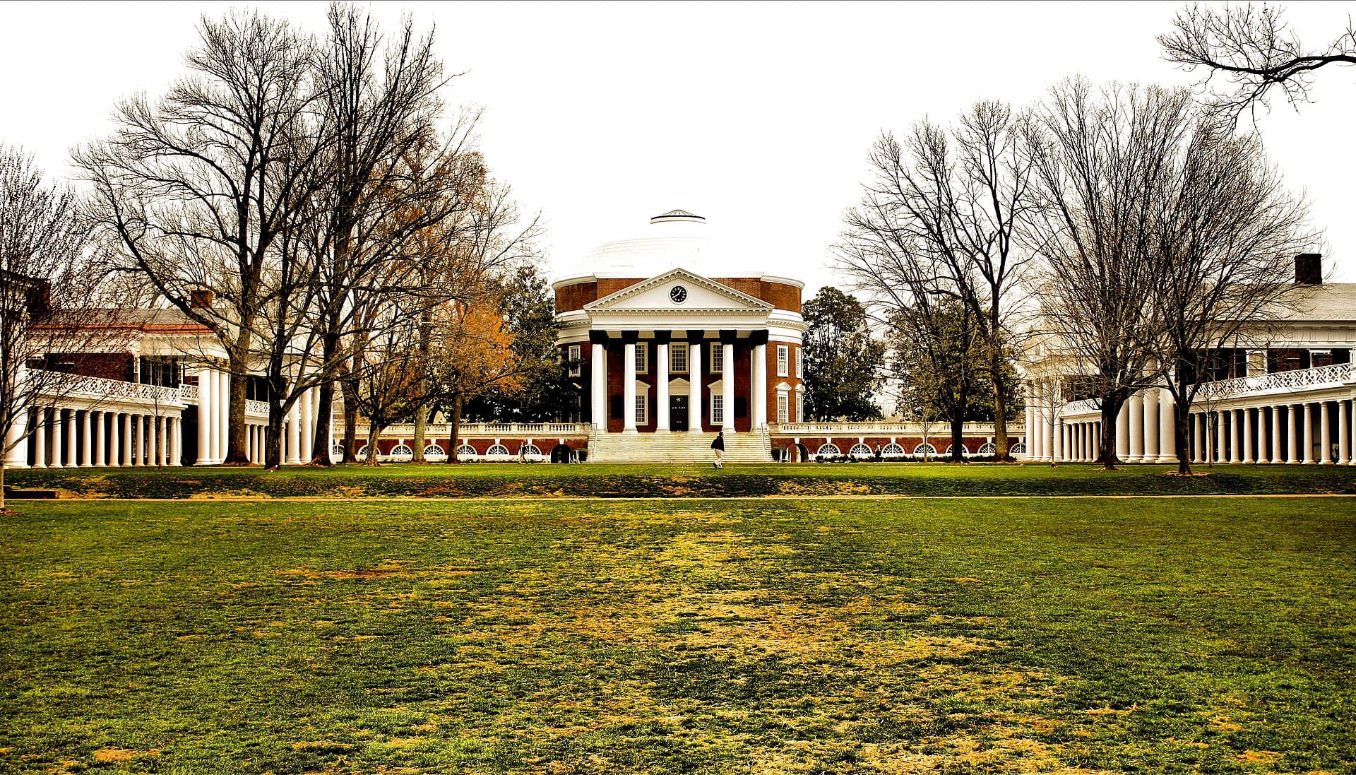 The domed Rotunda at the University of Virginia at the head of the Lawn, flanked by columned pavilions and bare early-spring trees